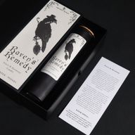 Raven's Remedy ritual spell card beside the candle