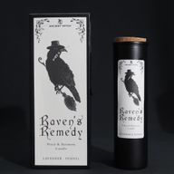 Raven's Remedy ritual candle and raven gift box on a black background
