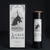 Locked Desires ritual candle and caged-bat gift box on a black background
